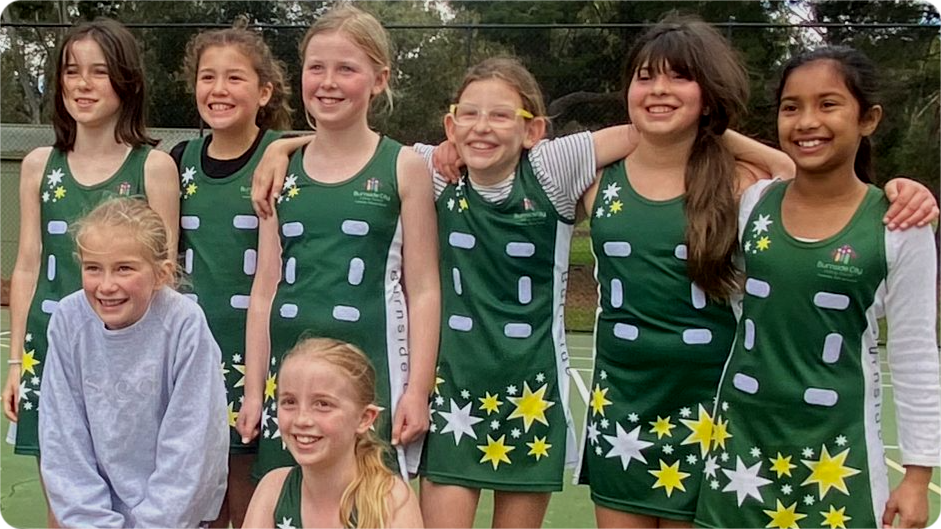 Young team and coach all smiling