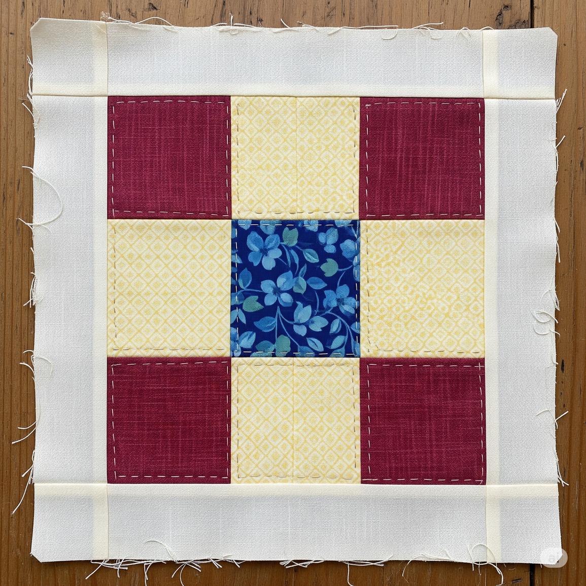 Nine patch block in red, yellow and blue