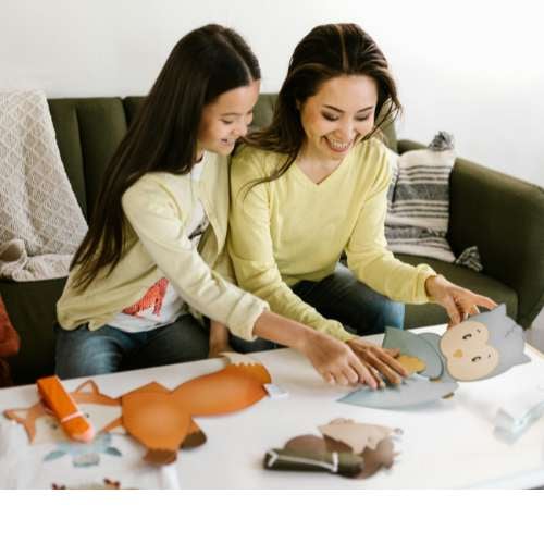 Homeschool mom and daughter engaging with hands-on, ready-to-go printable lesson packs and creative project templates at home