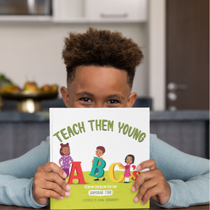 African American Child Holding Teach Them Young Book