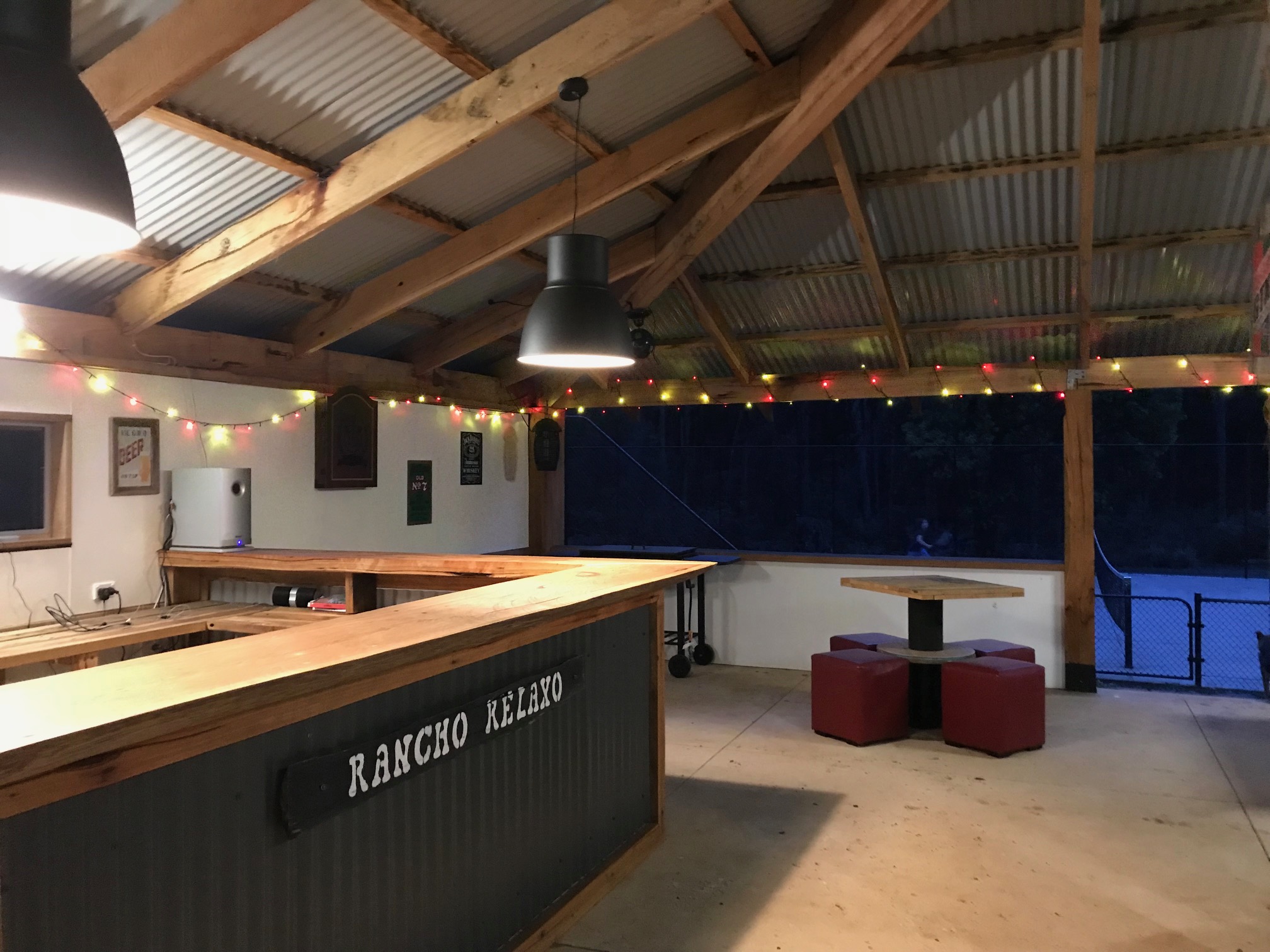 Rustic games room with pool table, timber bar, and cozy lighting at Andersons Eco Retreat