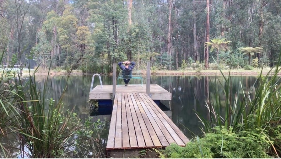 Greg relaxing on the restored pontoon at Andersons Eco Retreat after completing jetty repairs