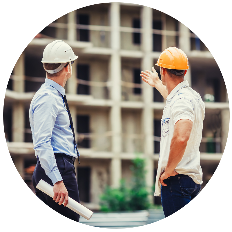 two contractors speaking on a job site