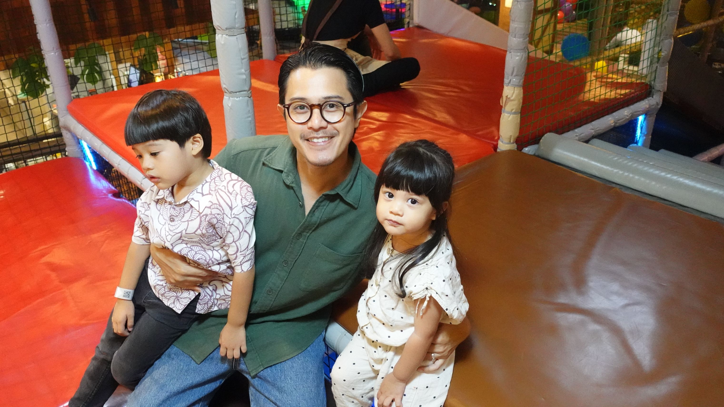 Helmi with his kids at a play centre