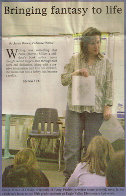 Author Paula Miller standing in kitchen with gray shirt