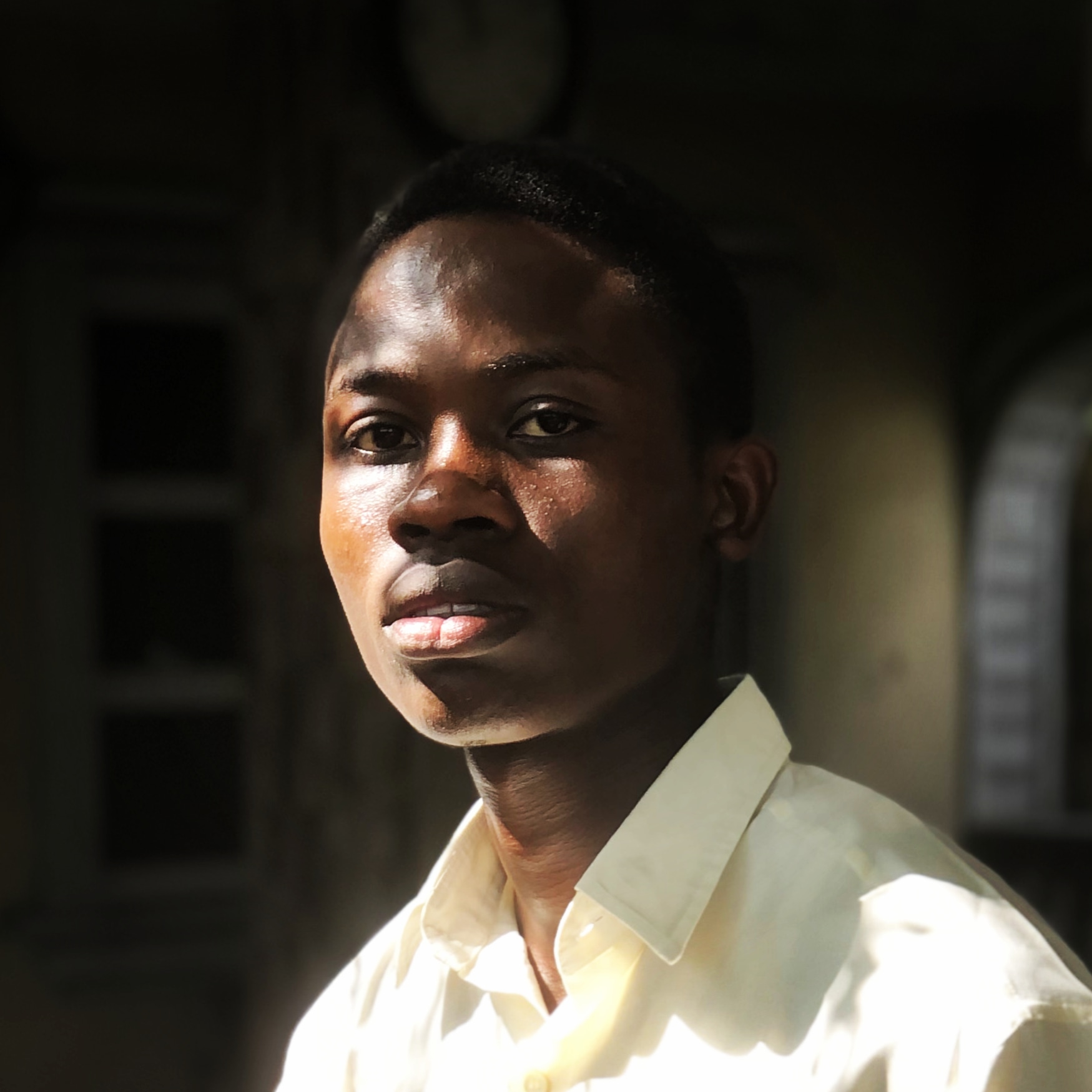 Passport photograph of Victory Idiagolor