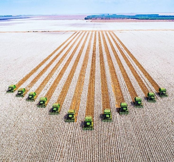 Aerial view of a very large farm with 12 tractors
