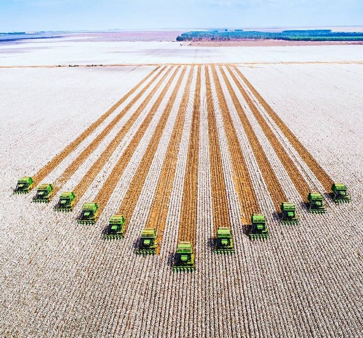 Aerial view of a very large farm with 12 tractors