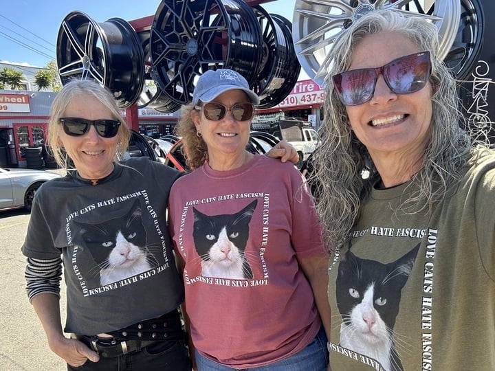 Three HAPI volunteers model our 