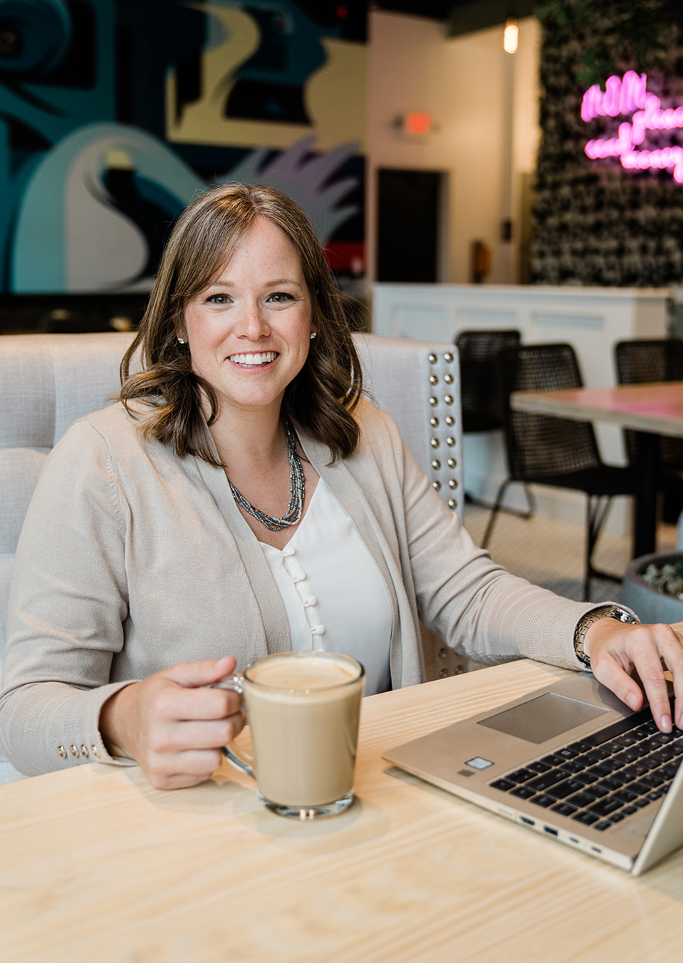 Erin with laptop and coffee