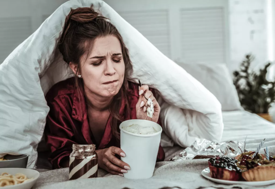 image 2. a woman binge eating
