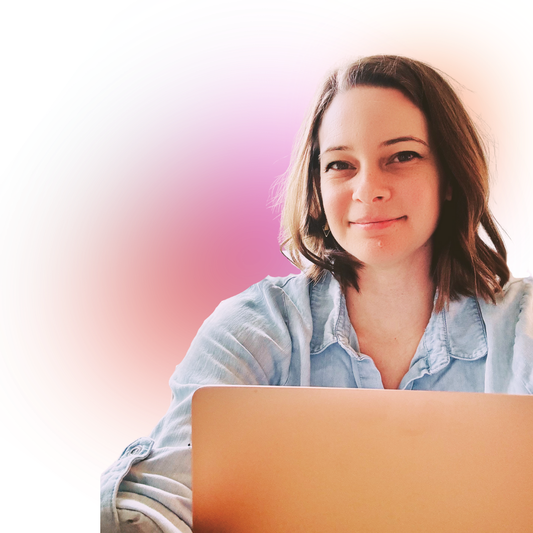 Picture of Brittany Kim sitting with laptop wearing a light blue shirt