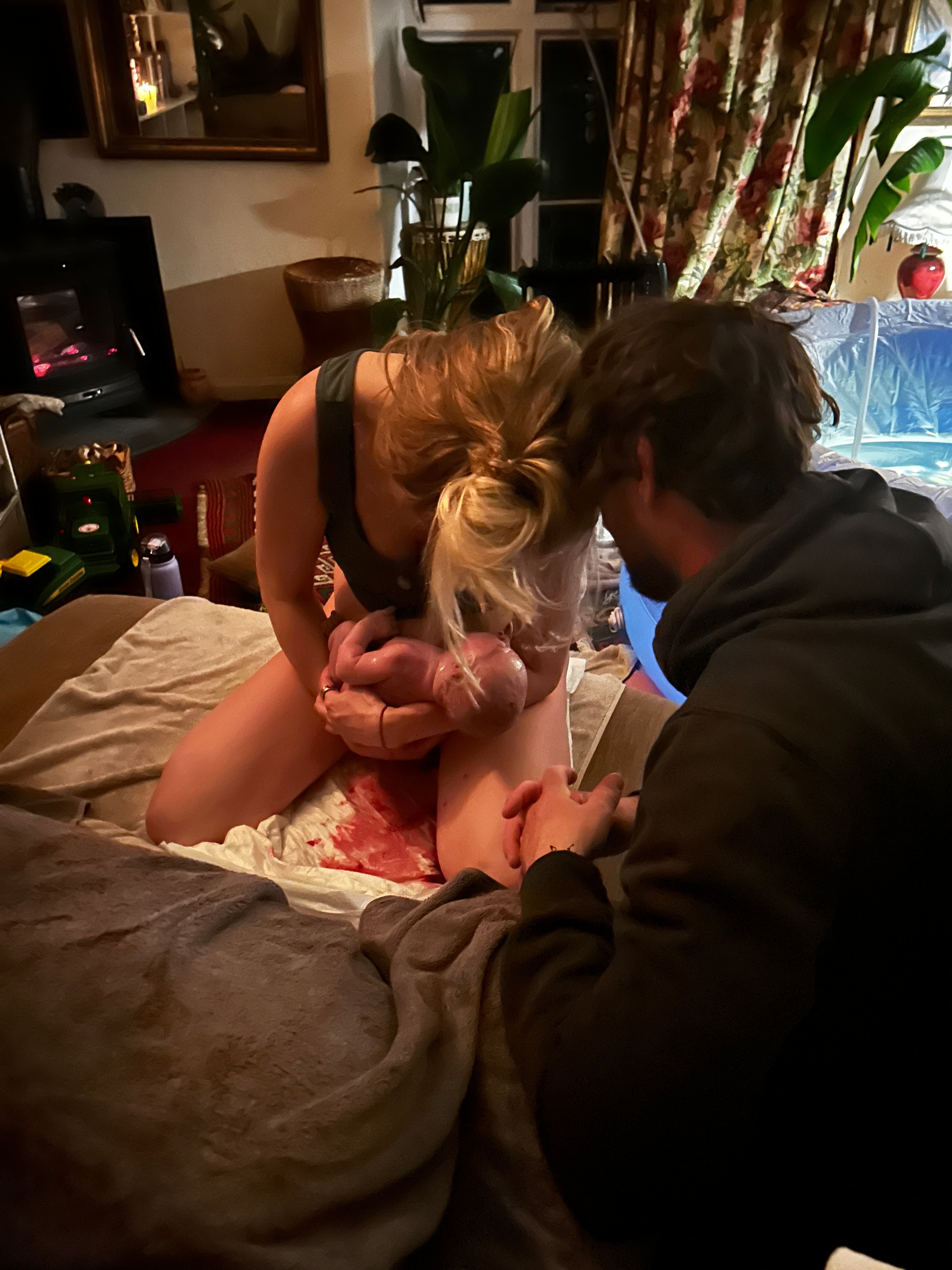 woman on sofa at home just birthed her baby