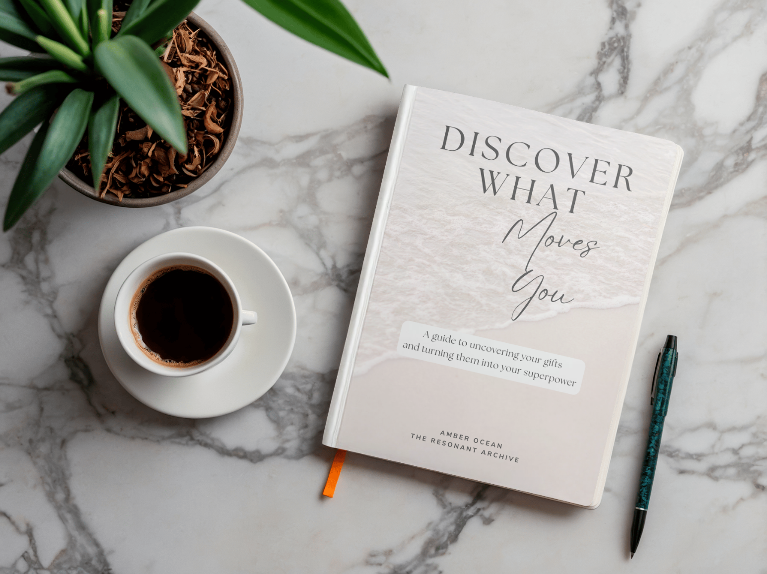 An image of a book titled Discover What Moves You next to a pen, a plant and 