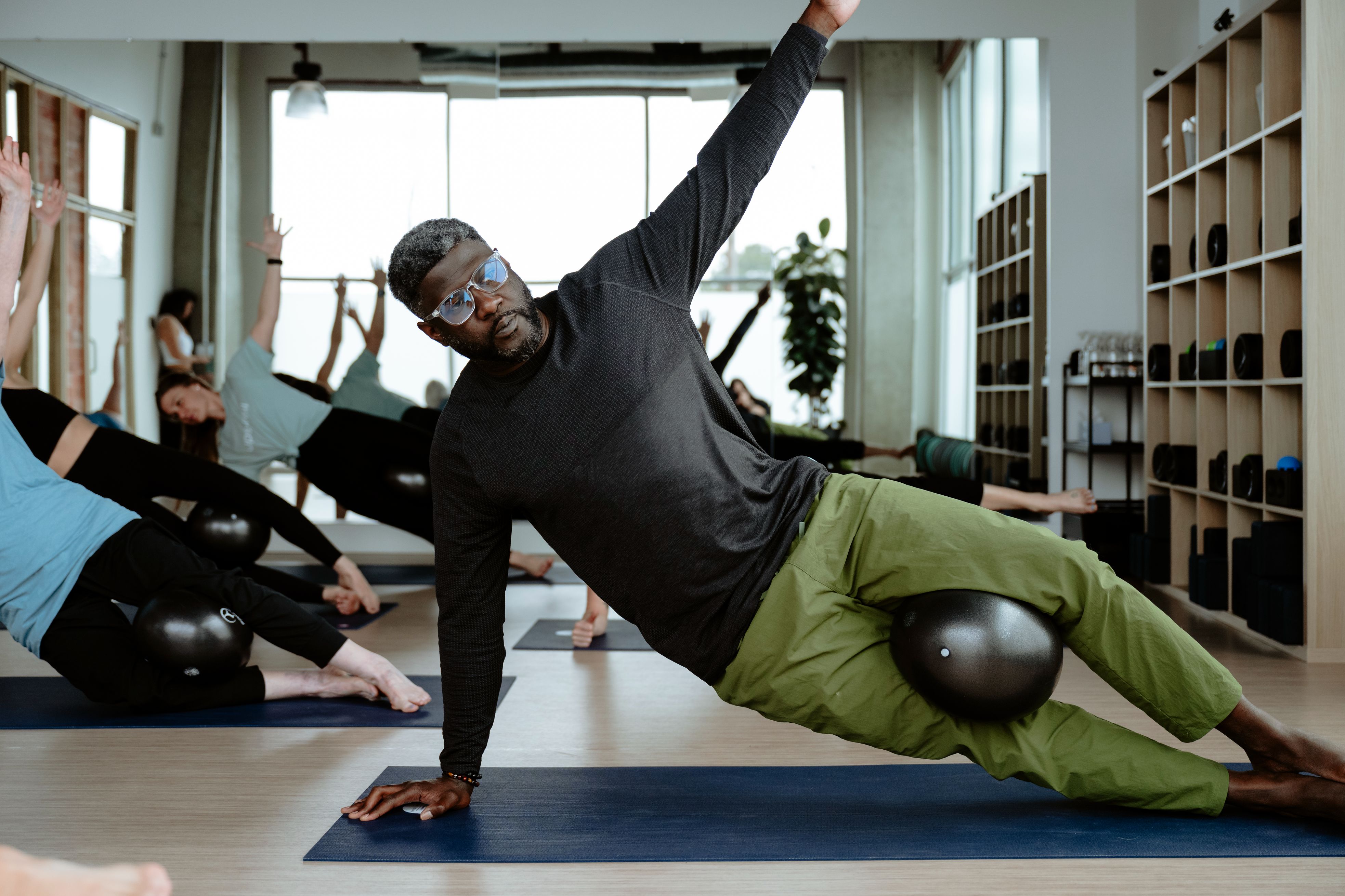 Denver wellness coaching focused on recovery, balance, and movement designed for an active Colorado lifestyle. Denver personal trainer demonstrating functional strength training and mobility work for JOTF Wellness clients.