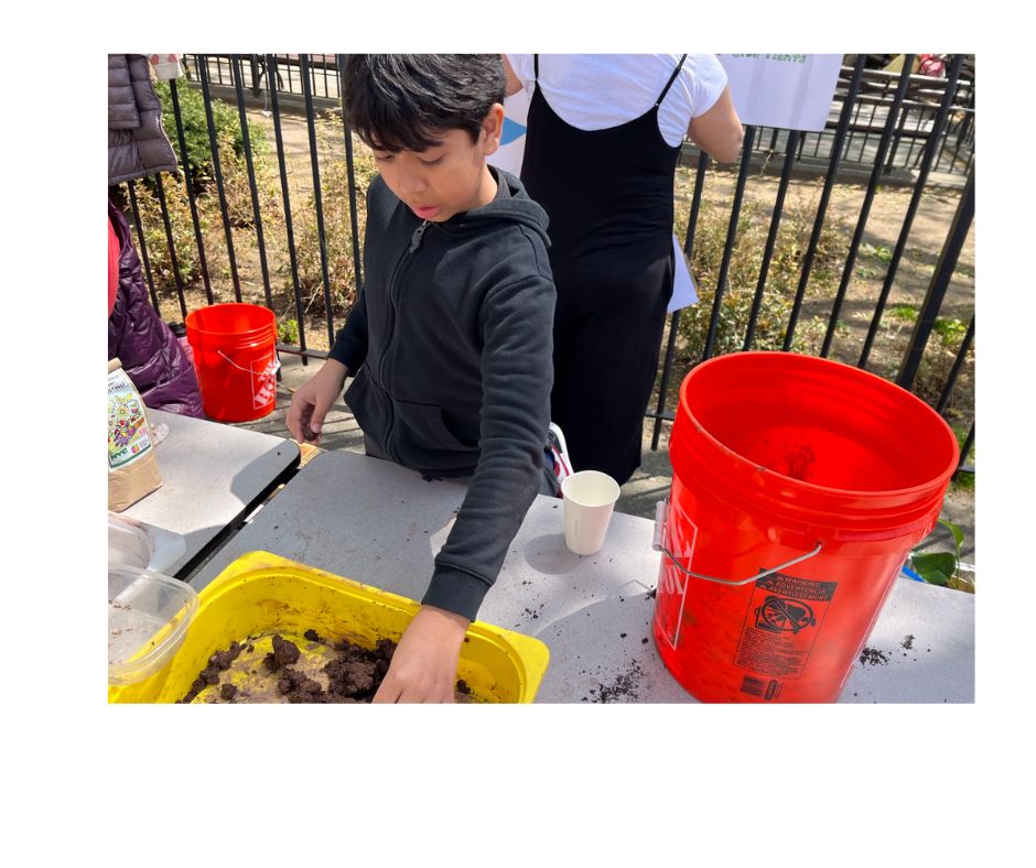 Our seed ball station mixed soil, compost, clay and seeds to make new plants wherever we go!