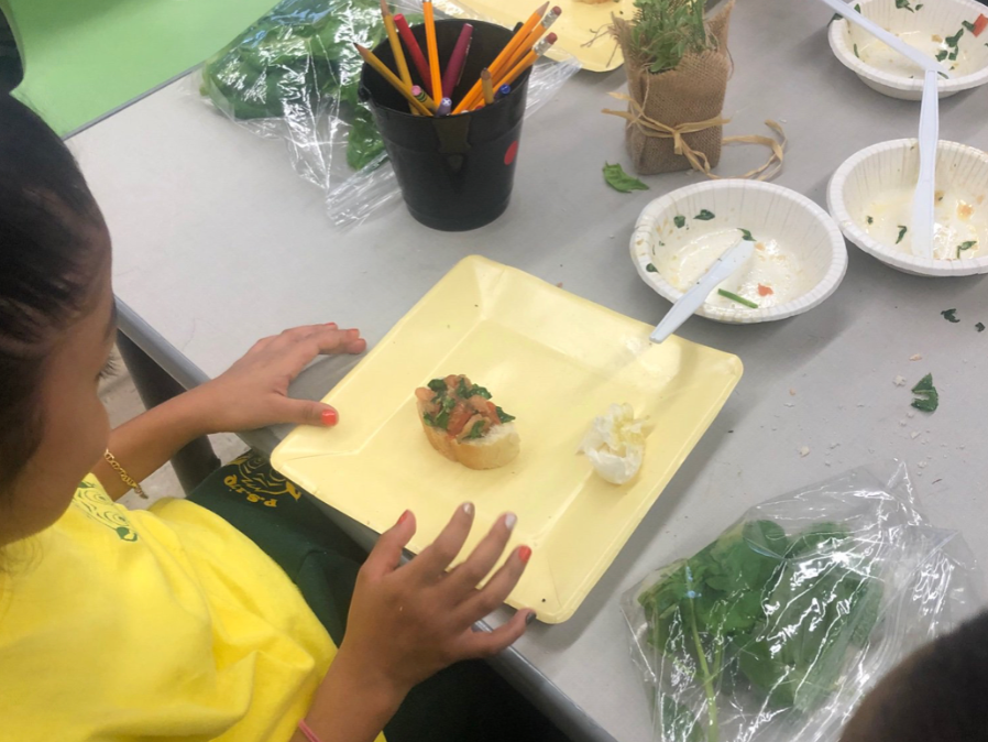 Ms. Dey's students make a snack from produce harvested in the hydroponic lab.