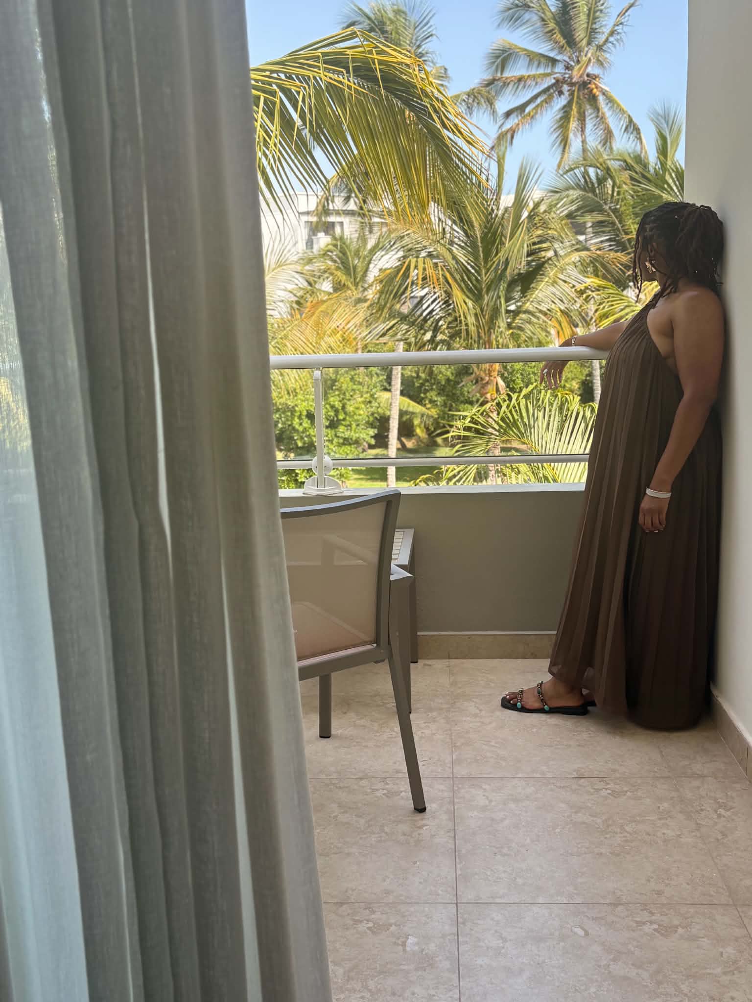 Kailynn (Author) on the balcony at the resort