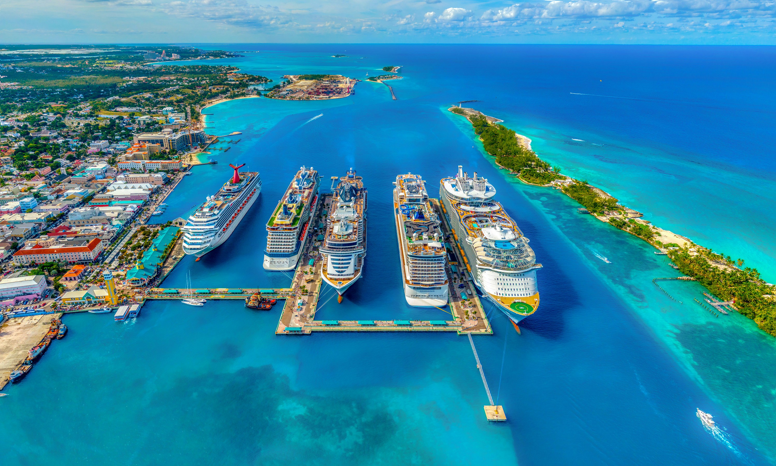 Aerial shot of a cruise port with multiple cruise ships docked
