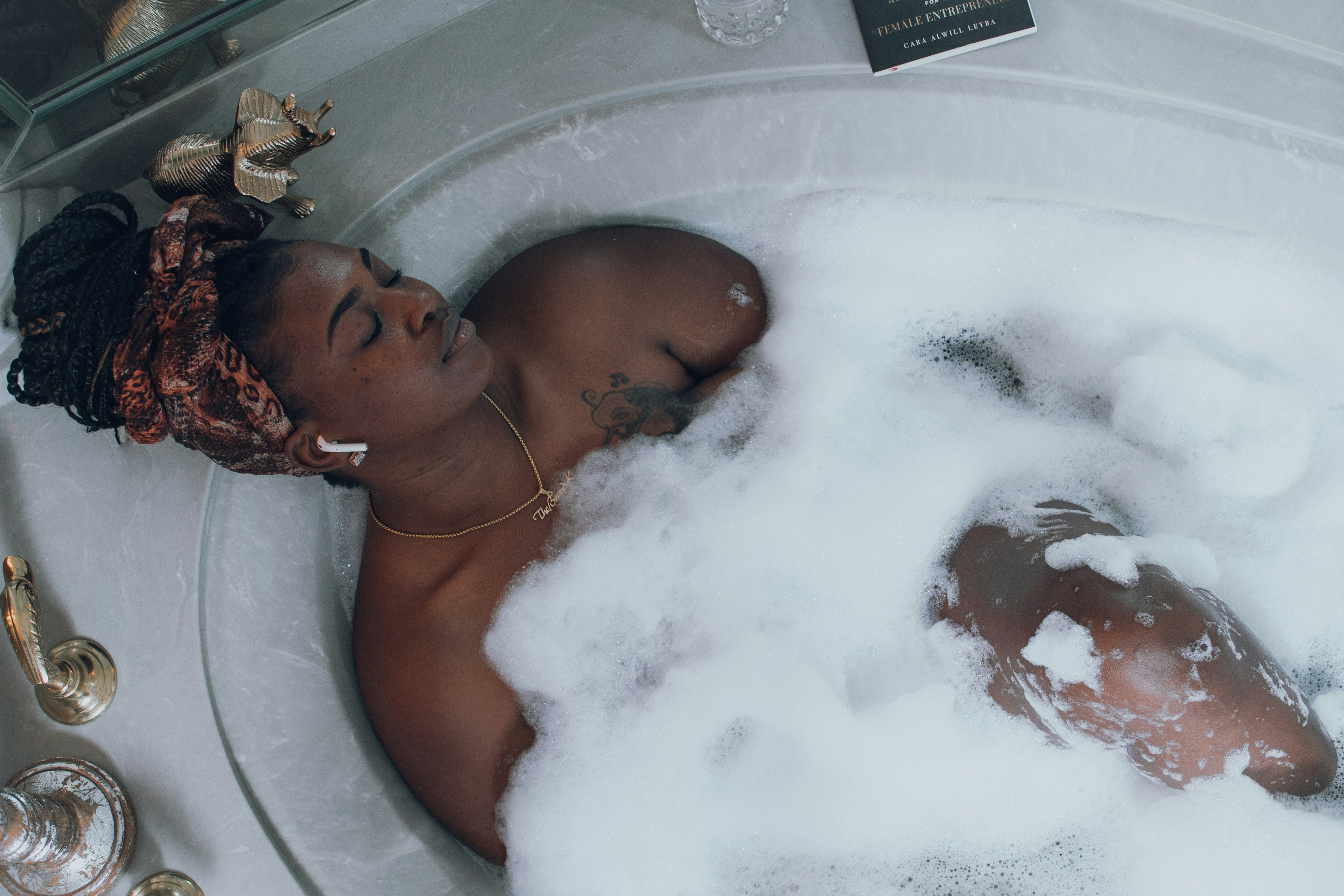 women relaxing in a bath tub