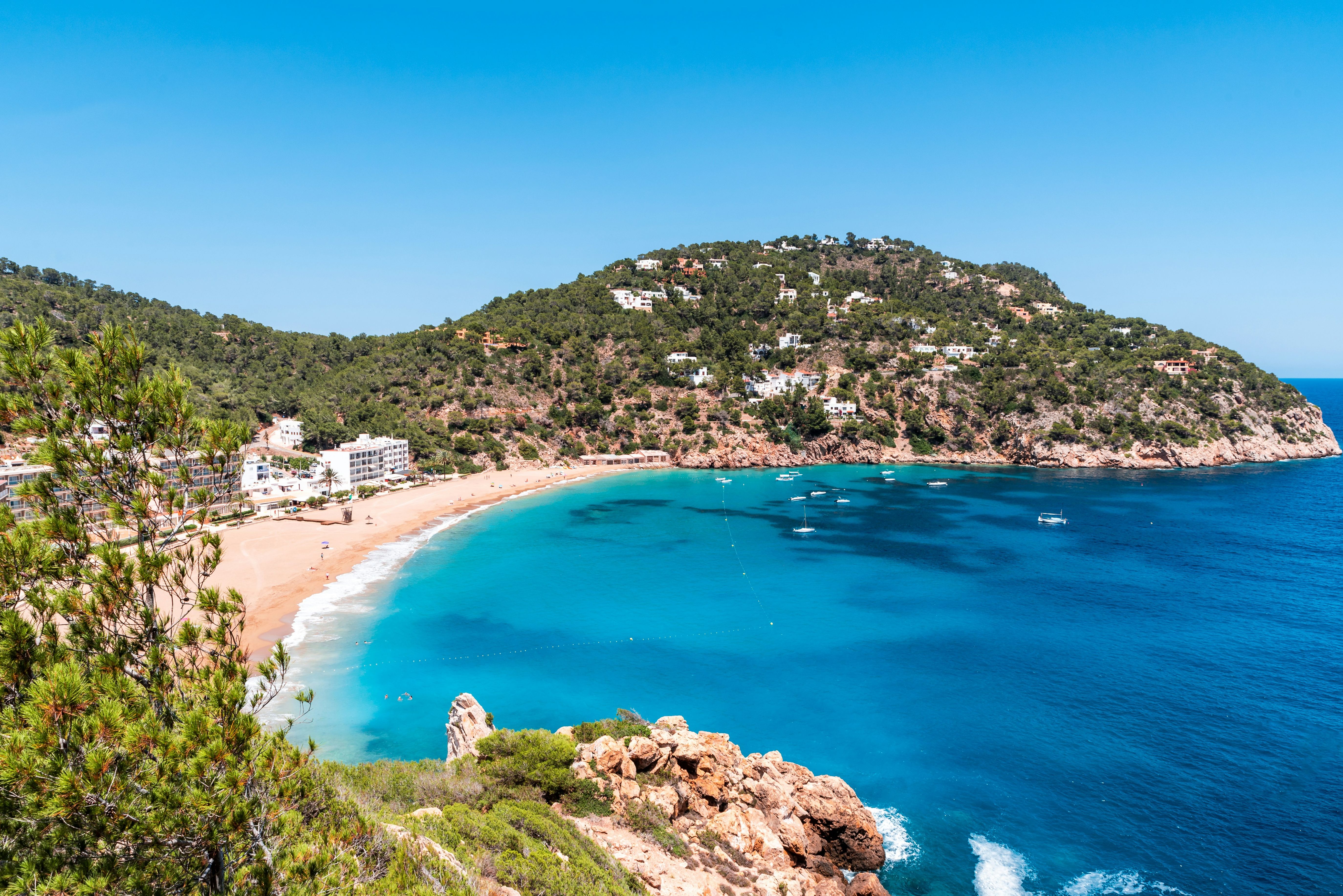 Beach landscape overlooking seaside resort in Ibiza.