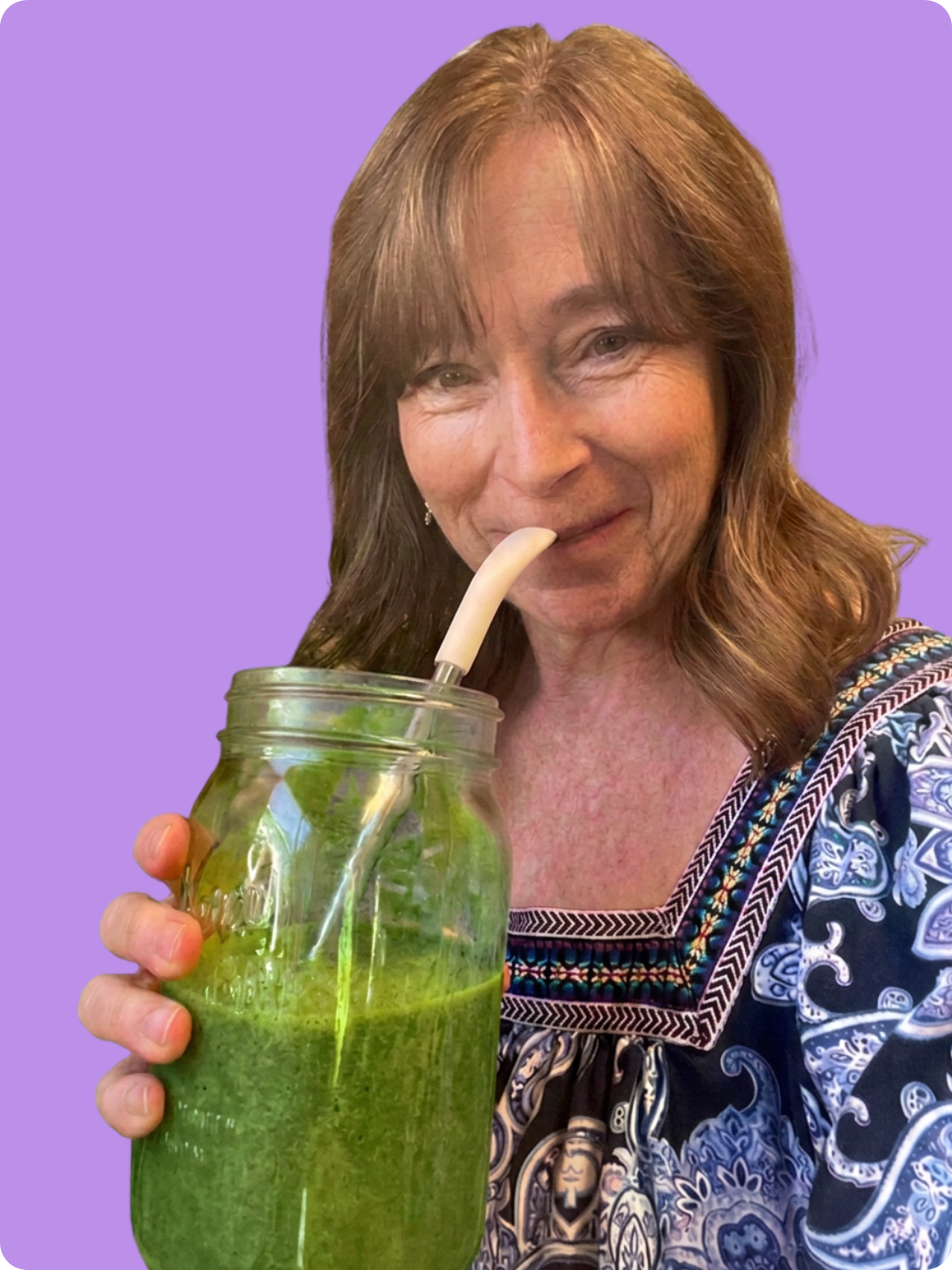 Amy Sando holding a green smoothie