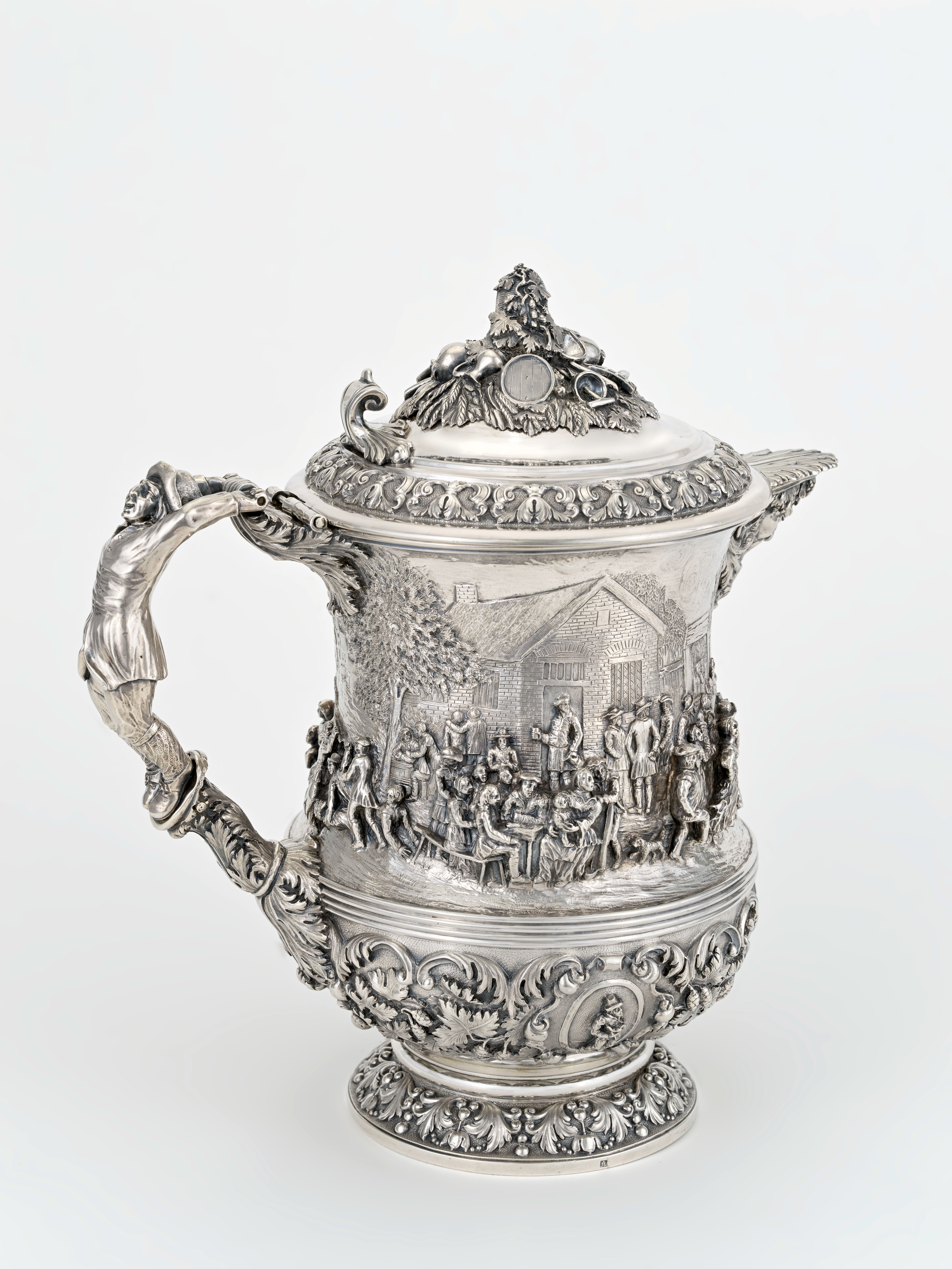 Brussels silver tankard with figural relief decoration, hinged lid and cast handle, silver and gilding, in the collection of DIVA Antwerp (inv. S2020-30), of the kind that anchors Antwerp and Brussels guild silver authentication.