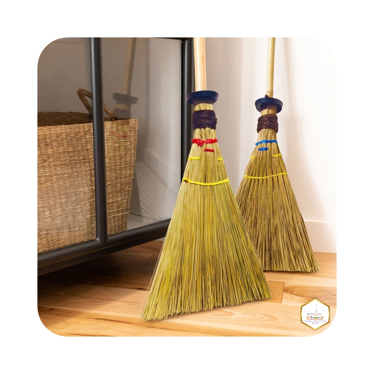 A pair of BT Brooms leaning against a wall in a bohemian-style kitchen.