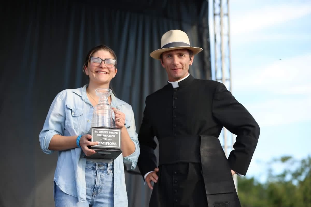 Becky Snyder, 2026 women's champion, holding her trophy