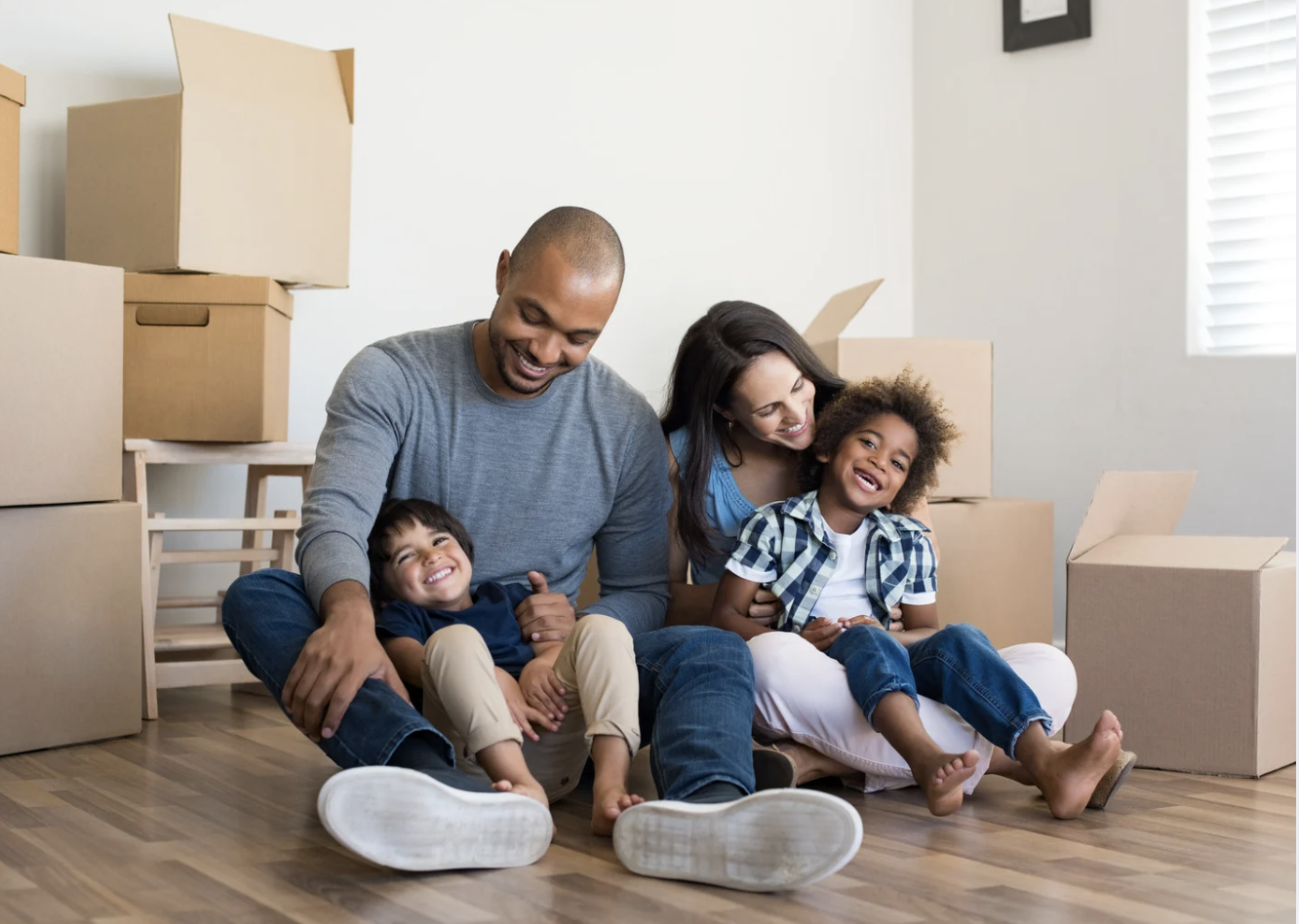 Family enjoying time together in their new home after moving in