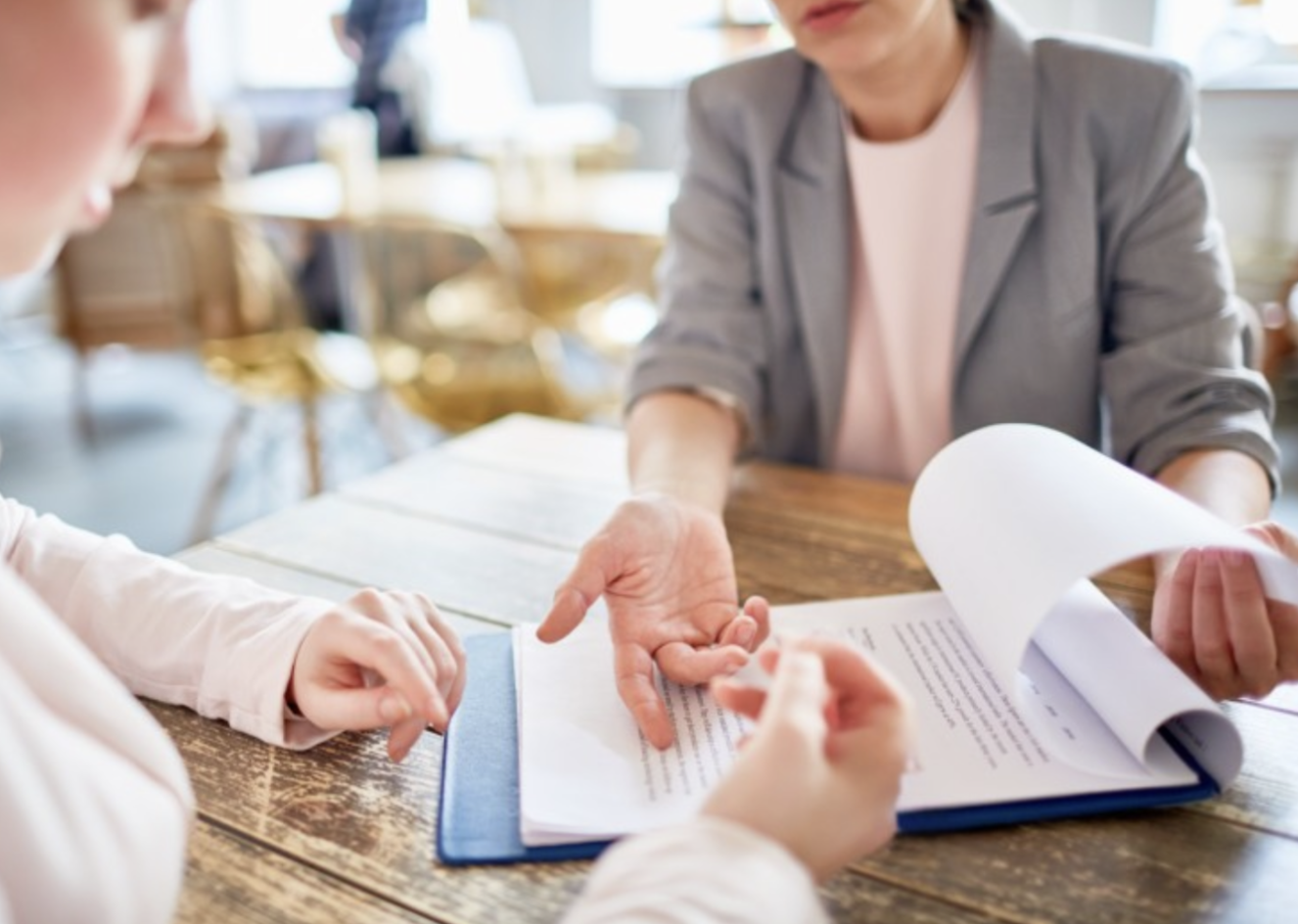 Client reviewing real estate and mortgage documents with advisor
