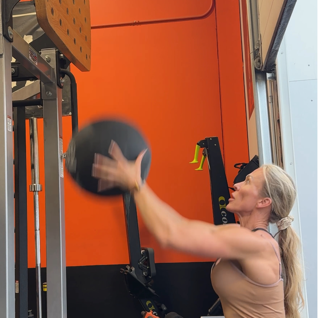 Sanja Malesevich strength training with wall balls during HYROX preparation at Body In Fushion Edmonton