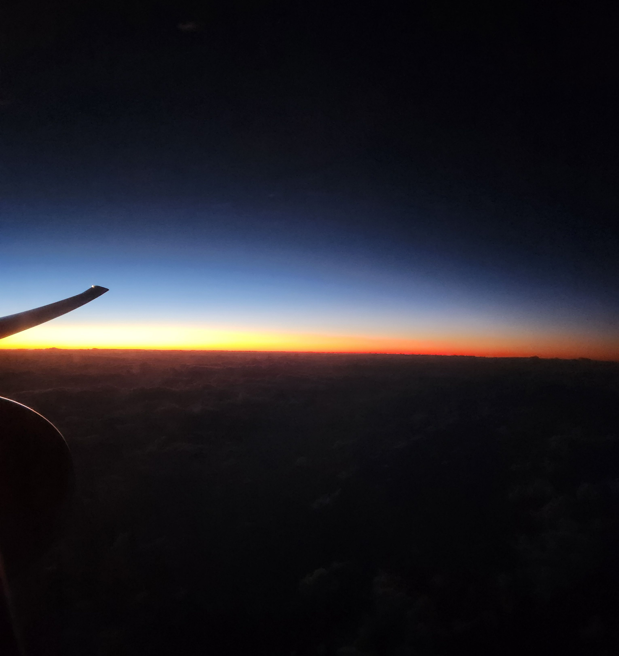 sunrise over the pacific at 30,000 feet.