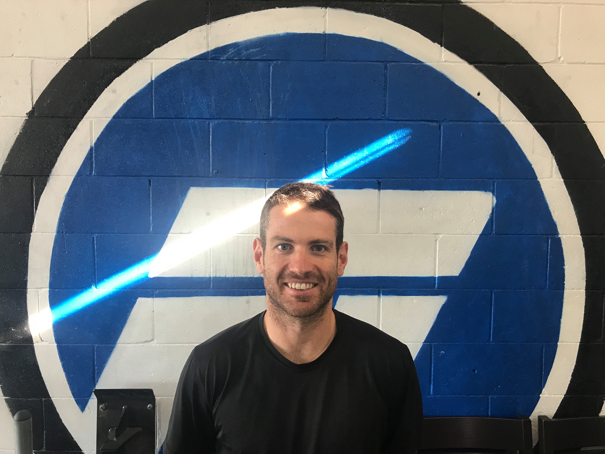 Matt in front of the Fusion F mural