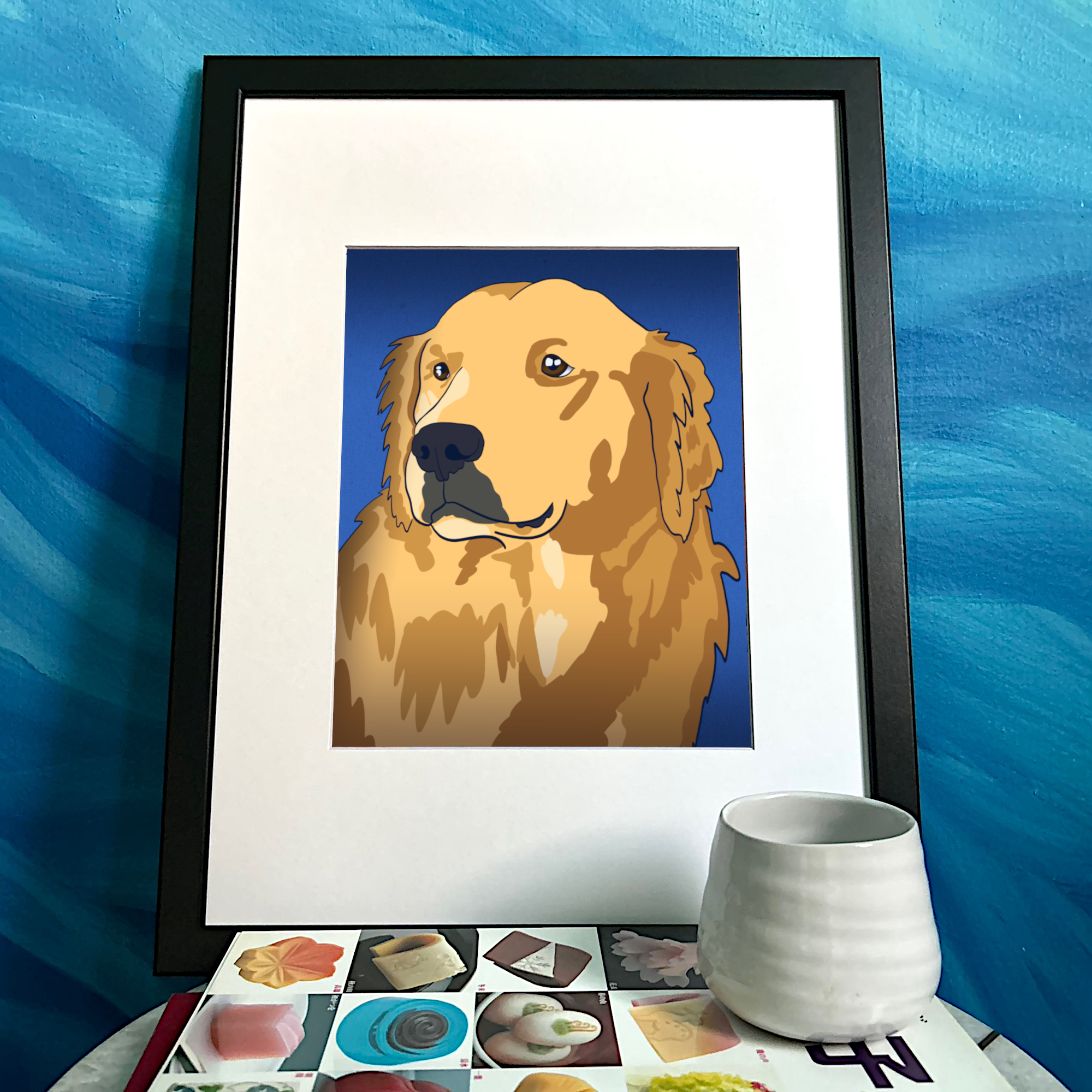 An illustrated portrait of a Golden Retriever with a blue background. It’s framed and sitting on a decorated side table.