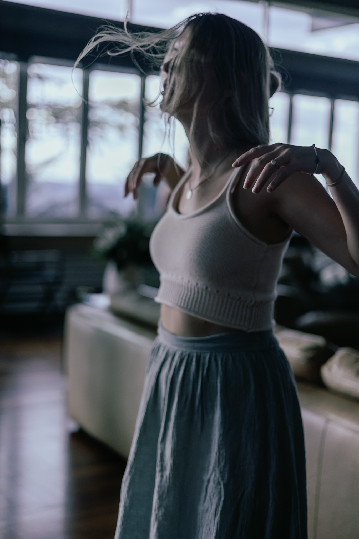 A woman dancing, hair in motion