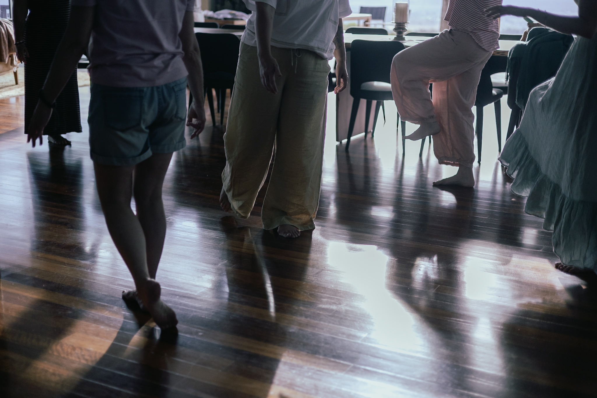 Women moving freely in a sunlit room