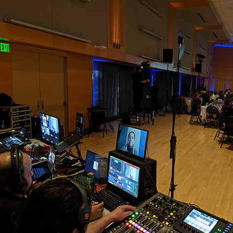 The view behind the tech table at a hybrid event.