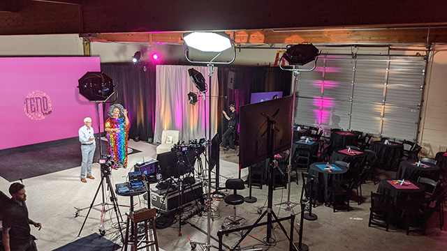 Hosts rehearse on the set before the in-studio audience arrives for a live streamed fundraising event