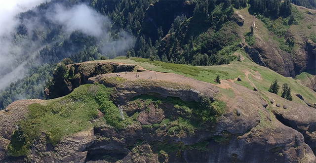 The top of the mountain is visible in the clouds in an image filmed by a drone.