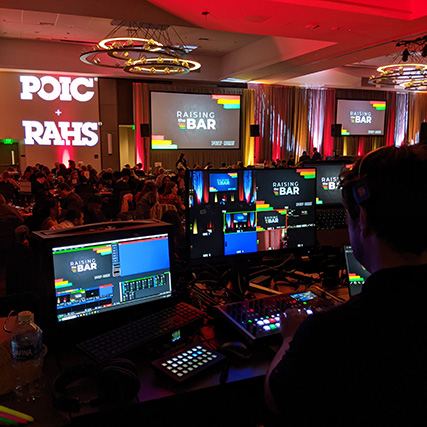 The view behind the tech table during the POIC + RAHS gala at the Hyatt Regency