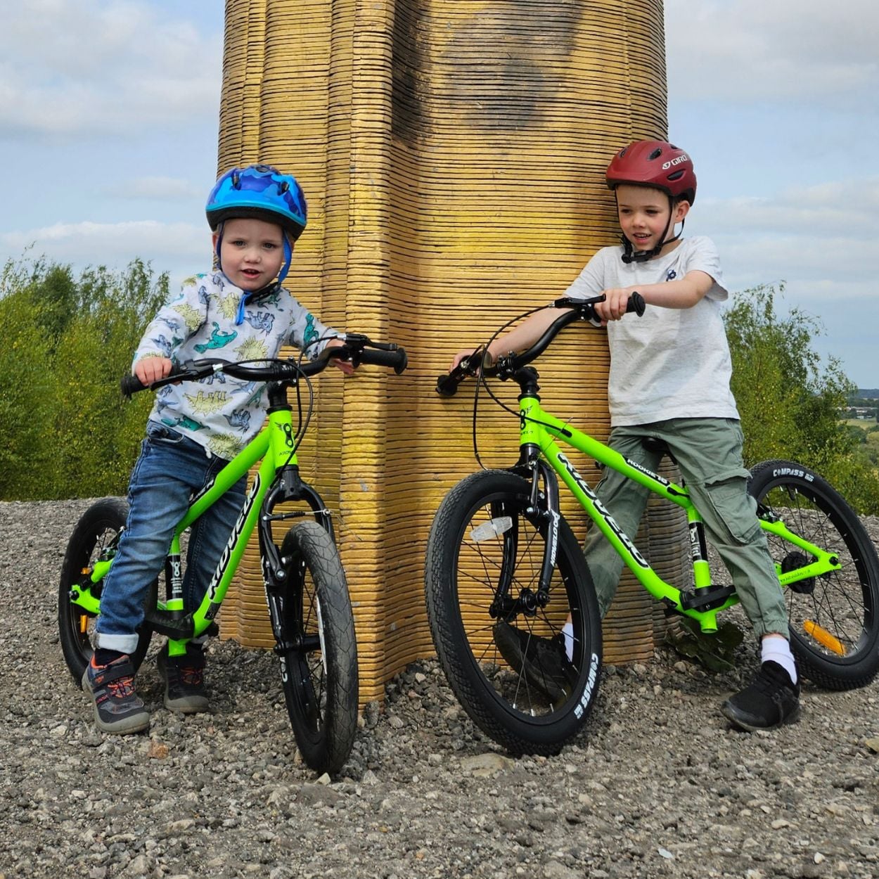 Two boys on green Kidvelo pedal bikes