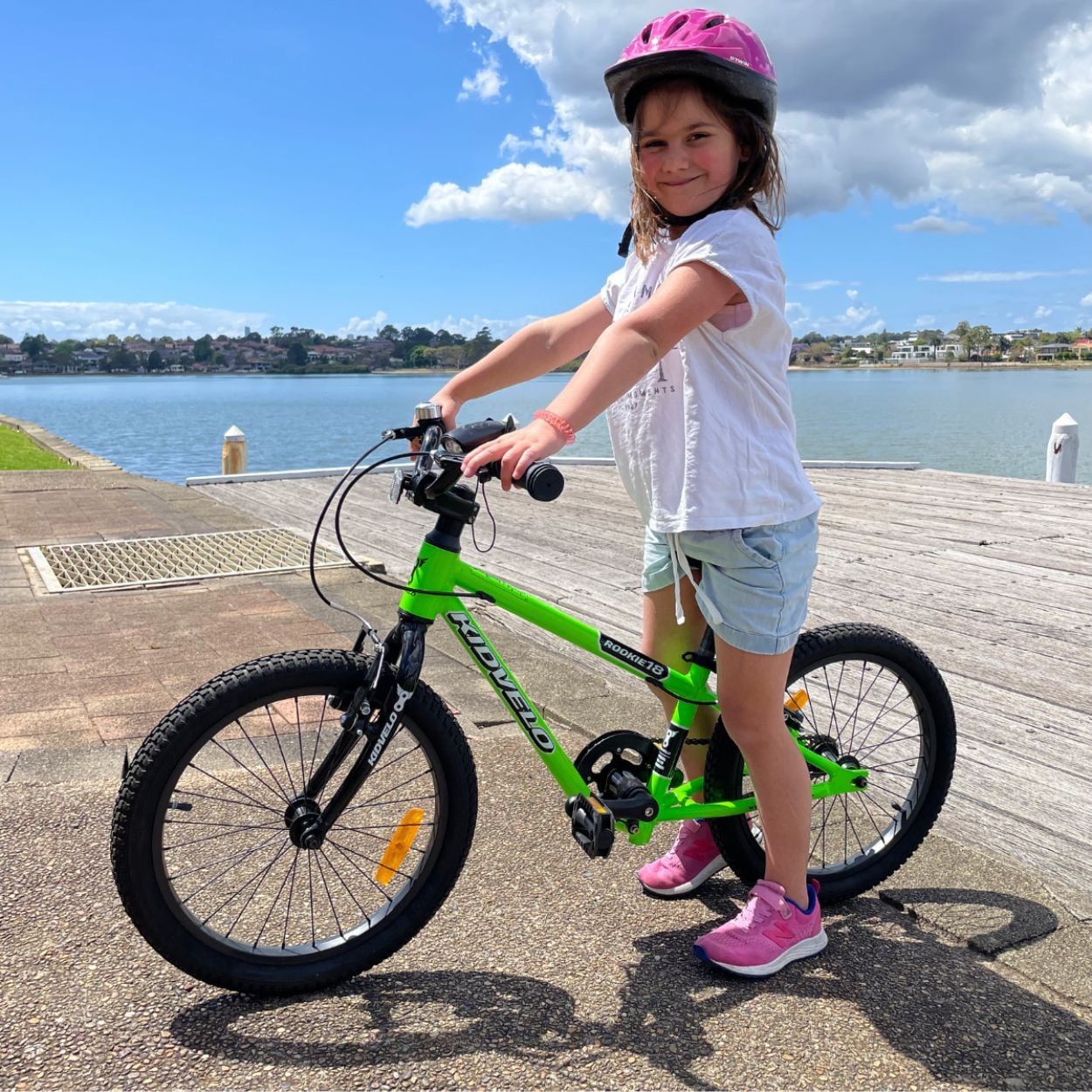 Girl on green Kidvelo pedal bike