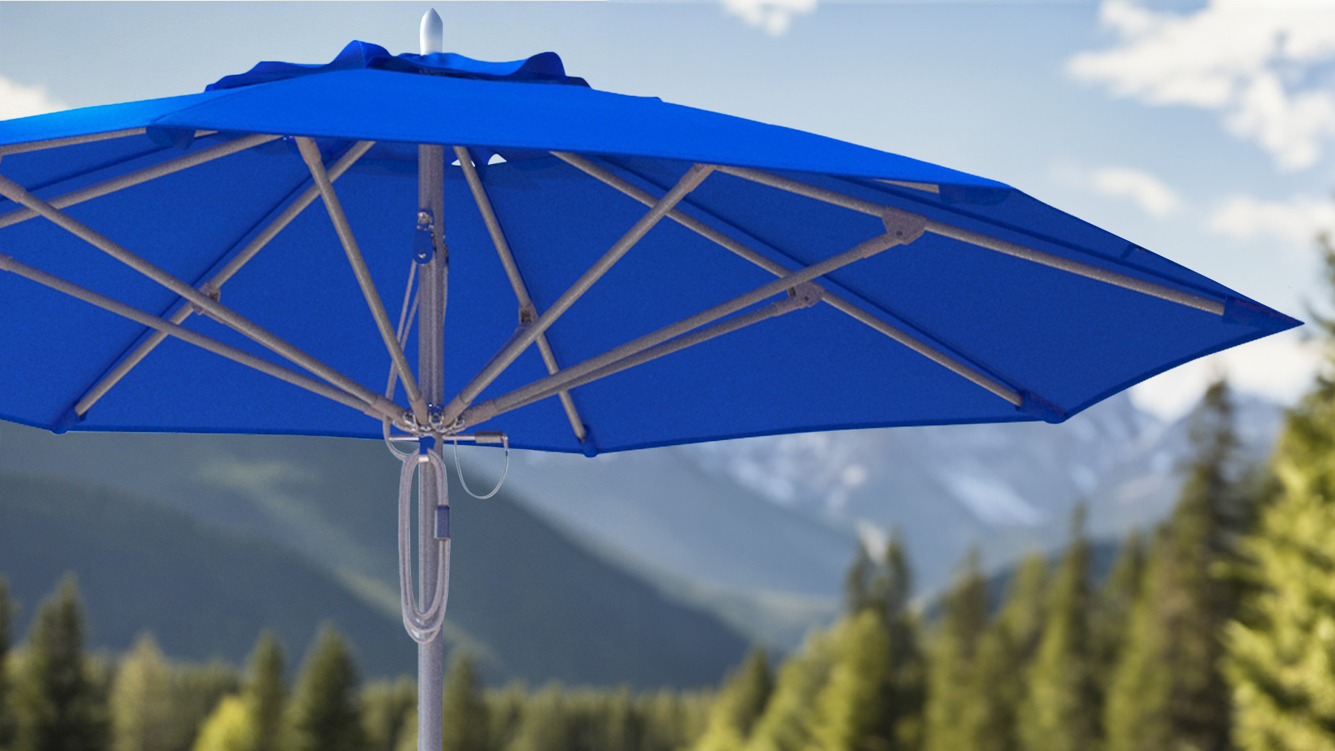 Close-up of a Newport Series Commercial Grade Patio Umbrella featuring a Sunbrella Pacific Blue canopy, set against a scenic backdrop of lush forests and distant mountains, showcasing its durable aluminum frame and stainless steel hardware.