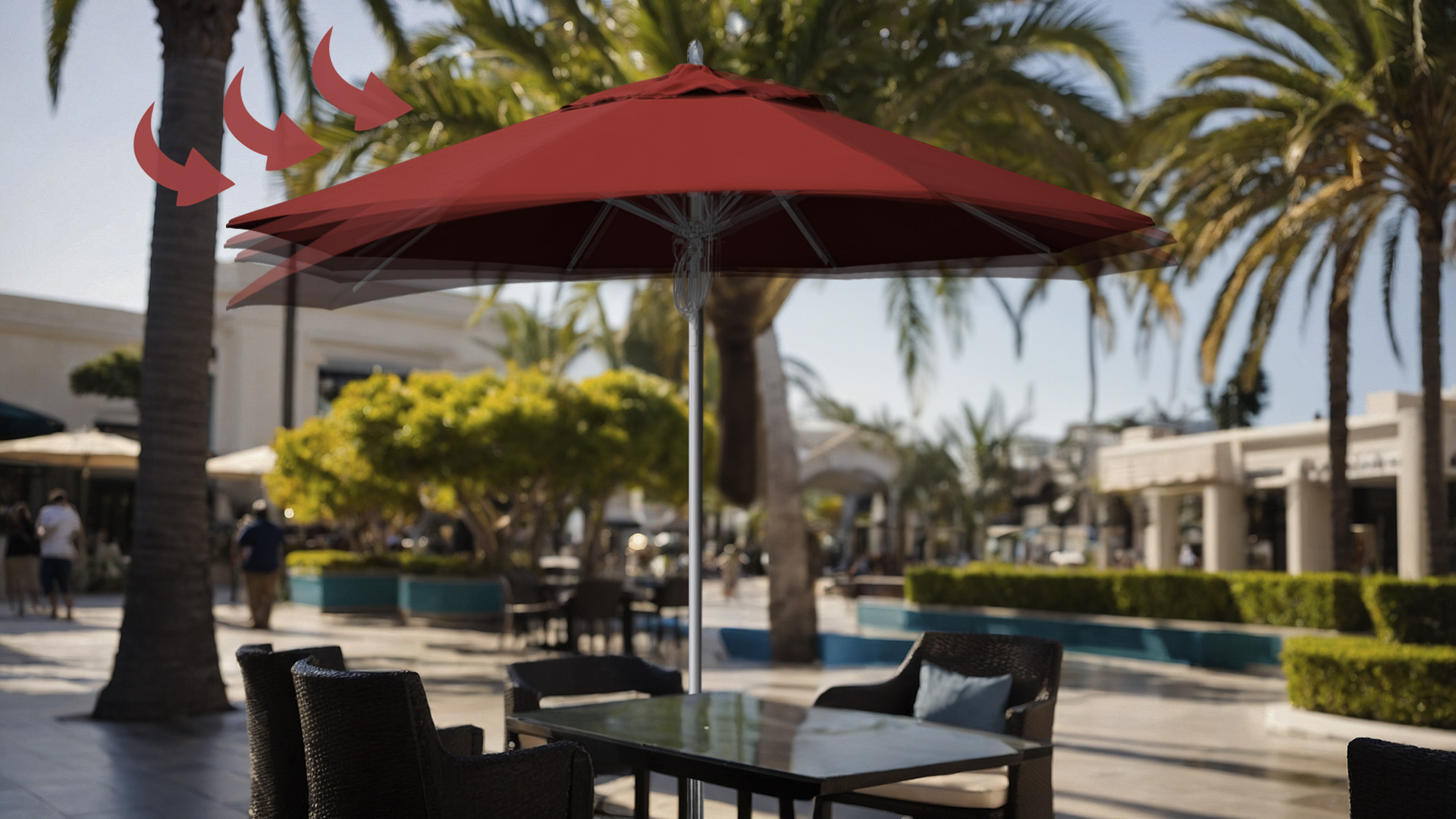 California Umbrella Rodeo Series umbrella with a Sunbrella Jockey Red canopy, showcasing its robust wind-resistant design in an outdoor commercial setting.