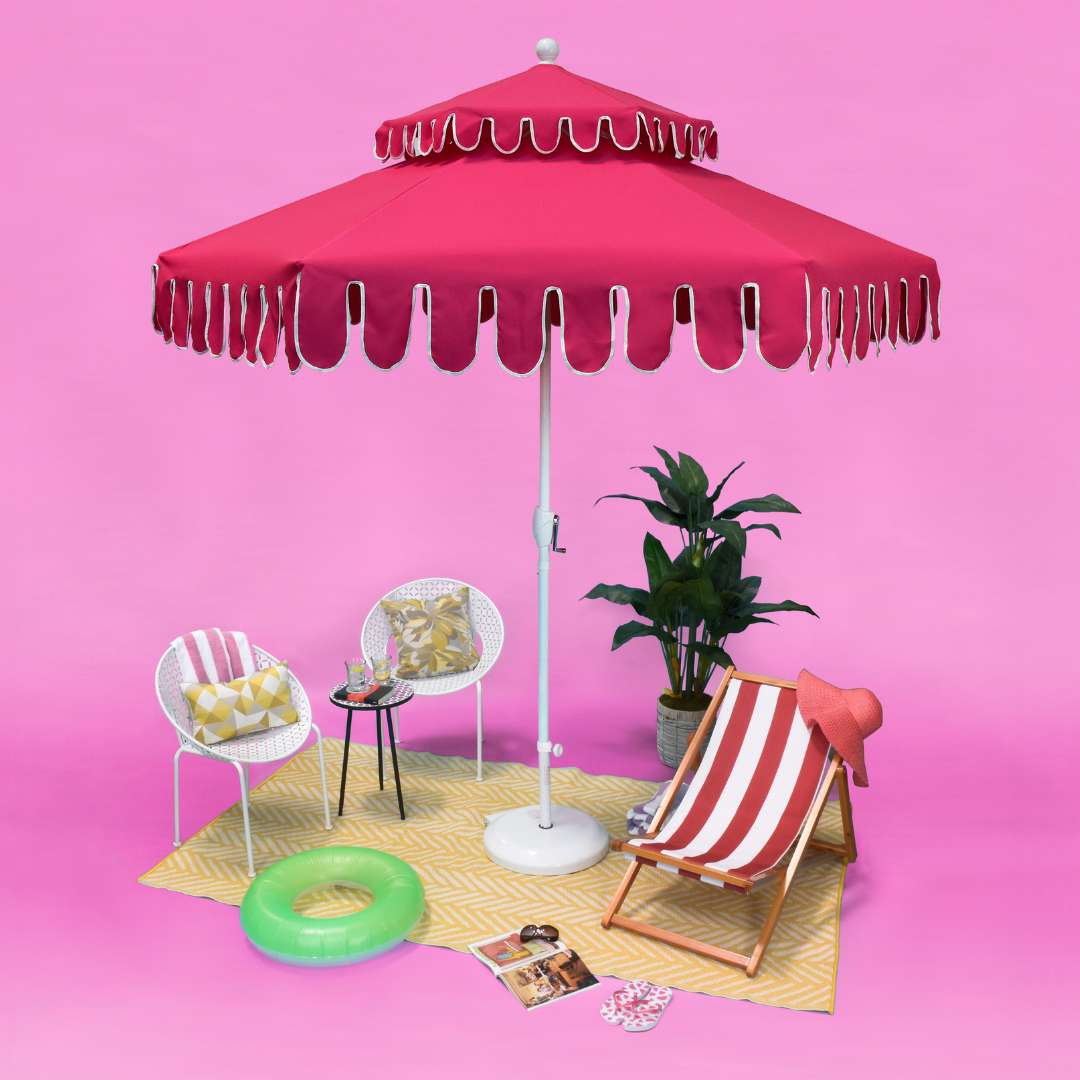 California Umbrella's Malibu Point Dream House Edition Umbrella in Candy Crush Pink, an elegant addition to outdoor spaces.