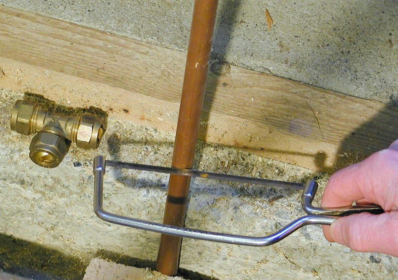 Plumber Repairing Pipe