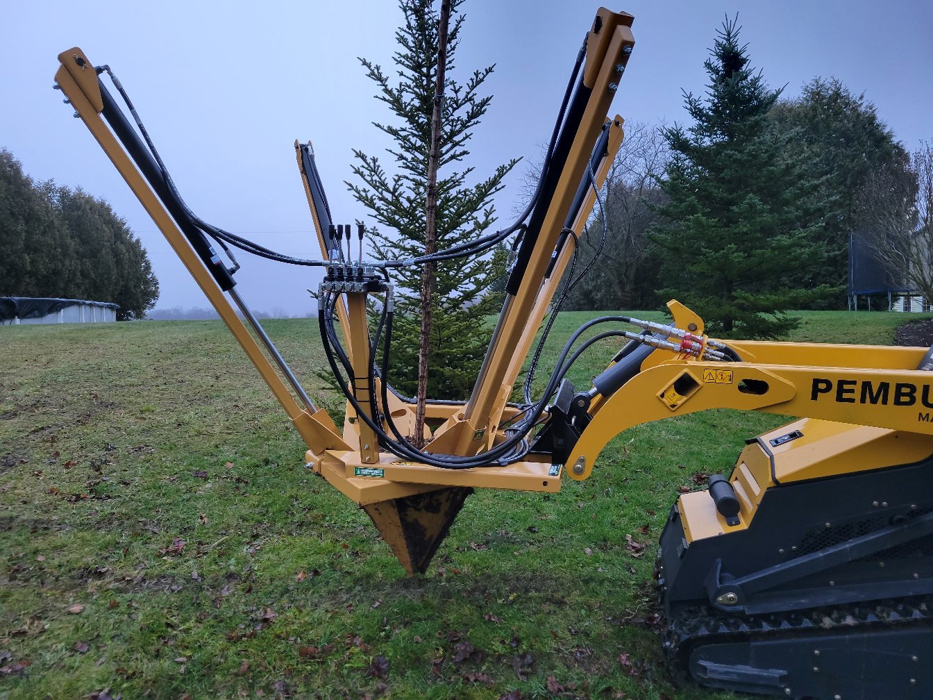 26 inch Kompact Tree Spade on a Mini stand on skid steer