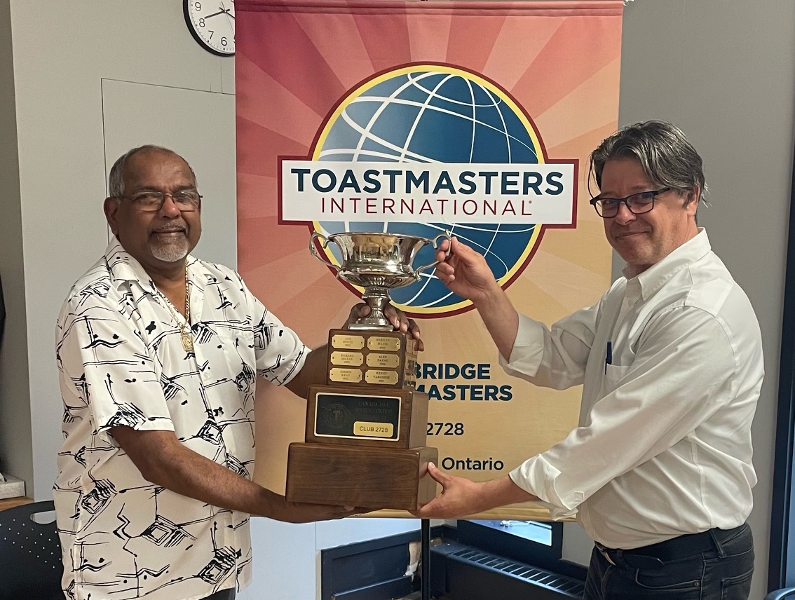 Artisan Asaad Kamaal, presenting the new handcrafted Canada Day trophy to Bill Kirby