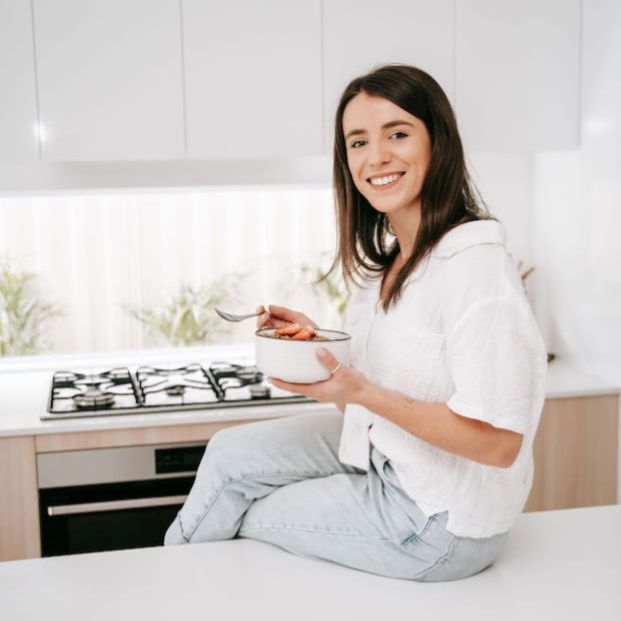 Woman preparing a gluten free meal in her kitchen